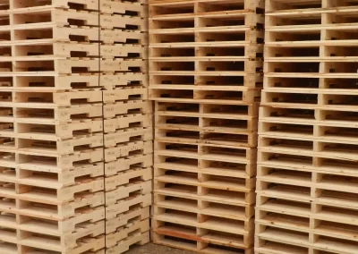 close up of tall stacks of wooden pallets